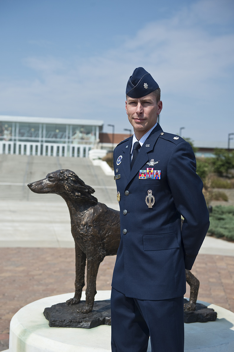 service member standing next to saluki statue outside banterra center